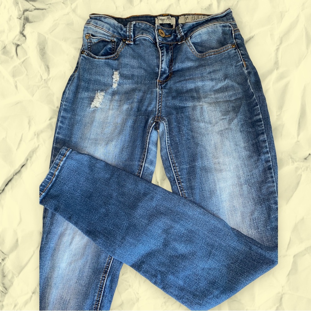 Distressed Indigo Rein skinny jeans.